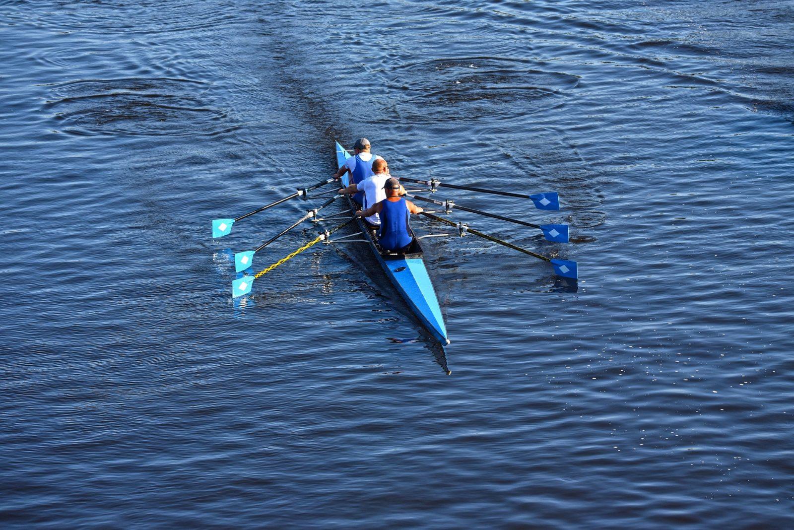 Three individuals rowing in a boat on the water. Thomas Bohrer, head coach of the BU men's rowing team, emphasized the team's work in training to make important improvements for upcoming races. COURTESY OF PIXABAY
