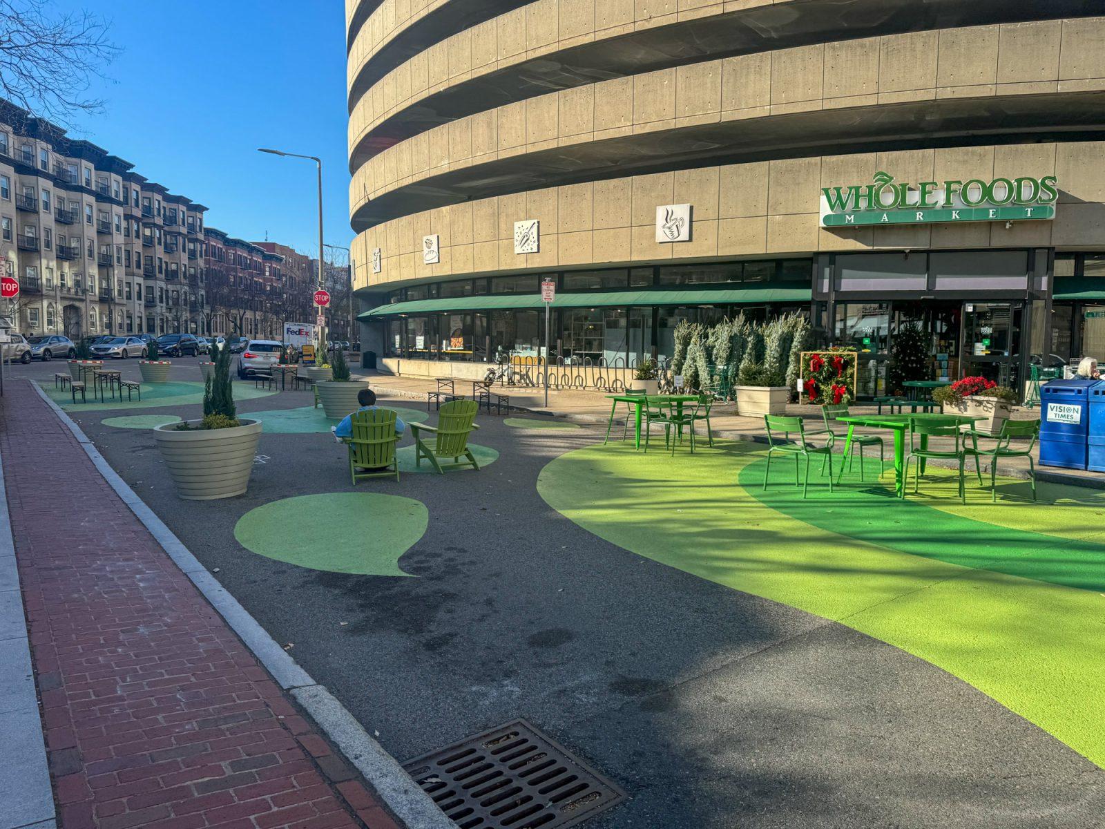 The New Edgerly Plaza outside of Whole Foods Market on Westland Avenue. The plaza was introduced by the Boston Transportation Department to promote a  safe place for pedestrians to eat and sit outside. PHOTO BY SAMANTHA GENZER 
